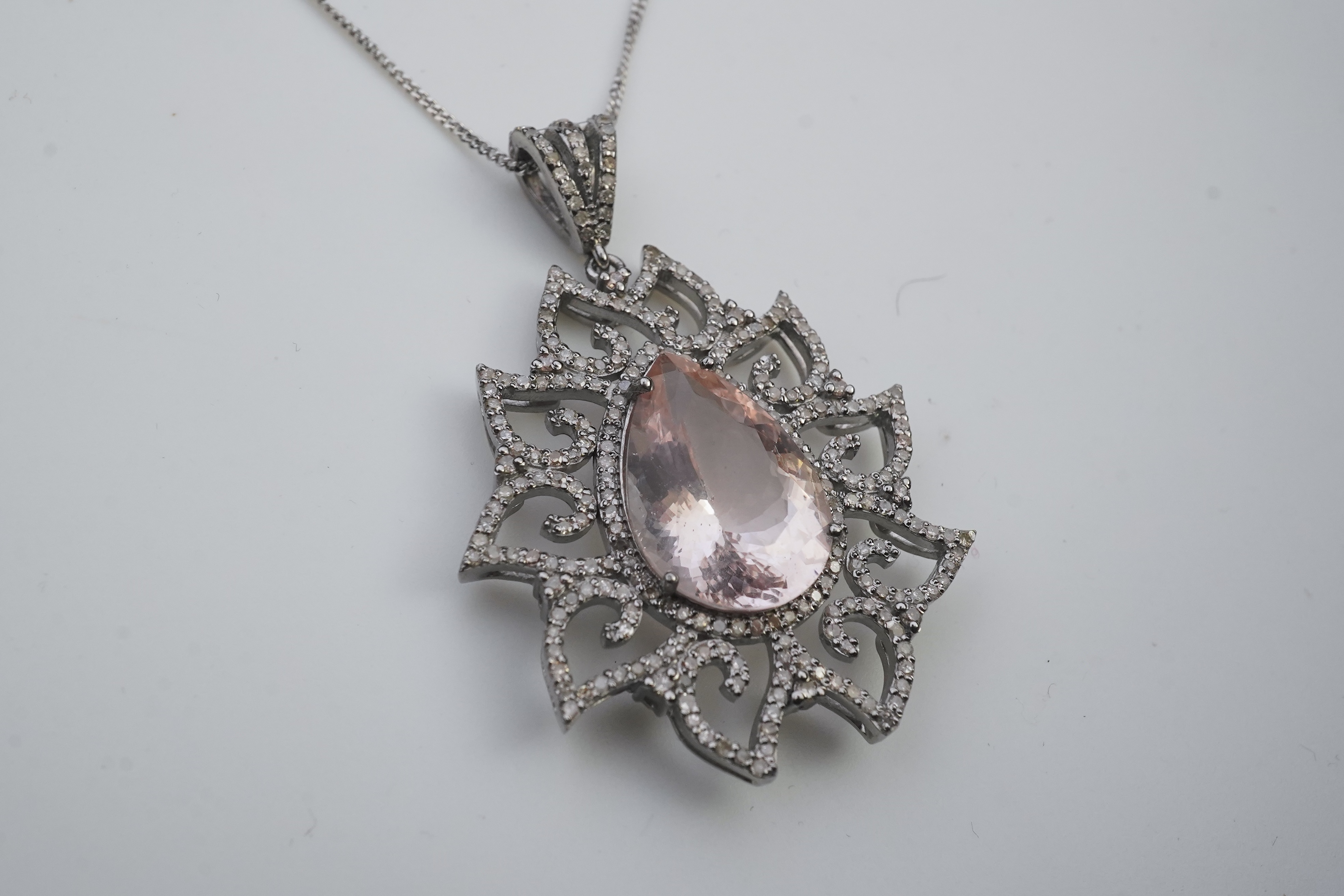 A morganite and diamond pendant